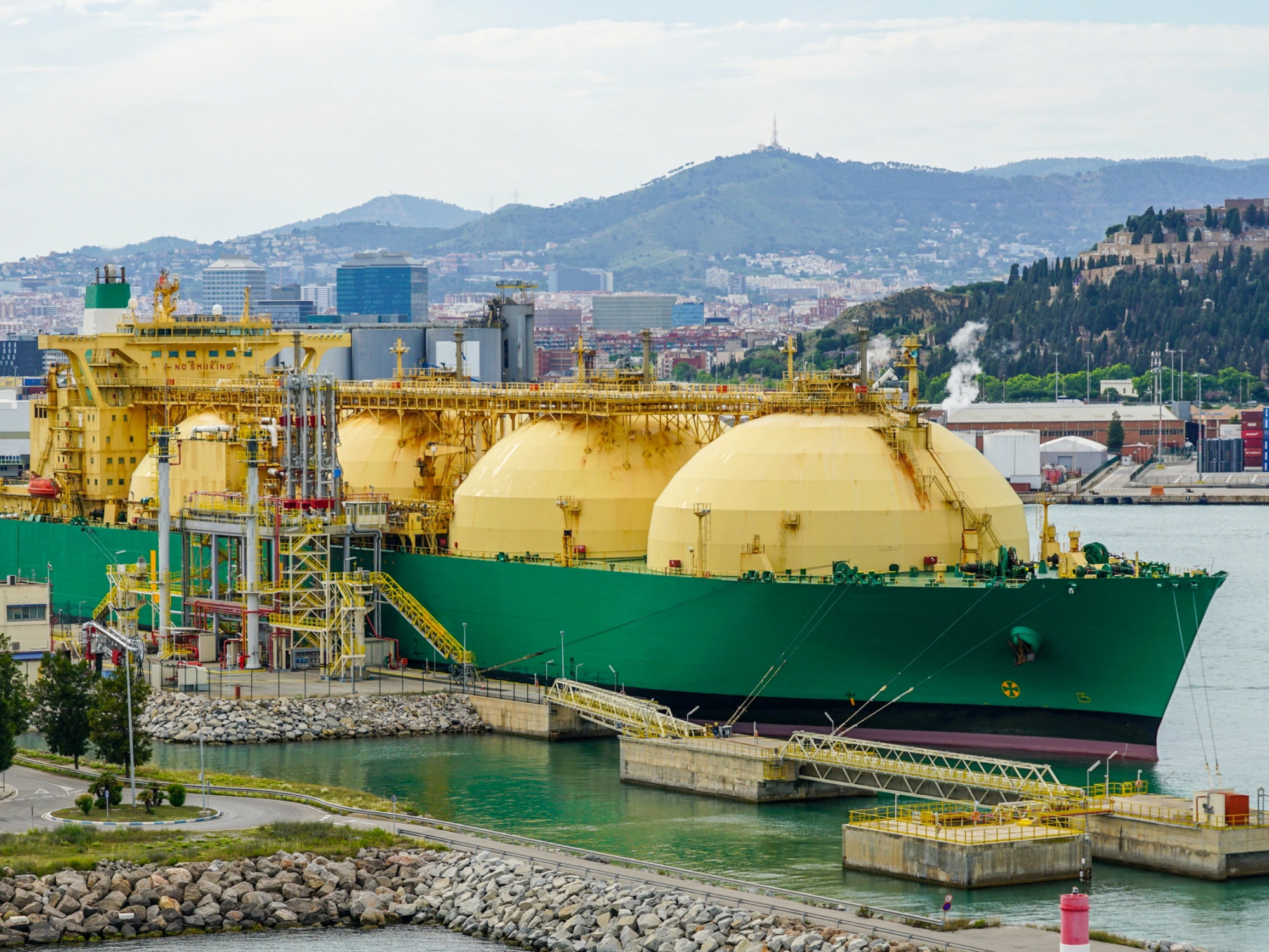 Liquefied natural gas tanker unloading at international gas terminal