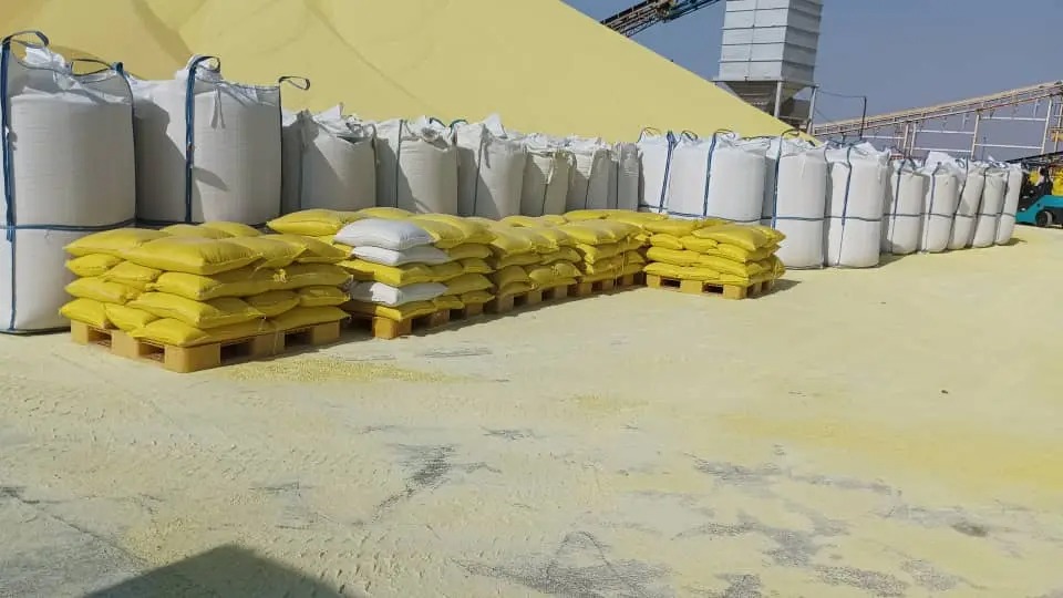 Granular sulphur stockpile and bulk bags at a port